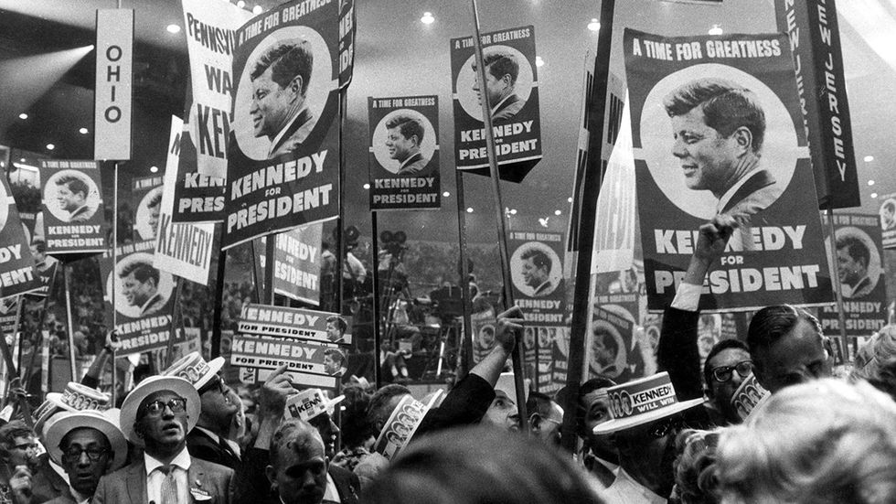 1960 JFK supporters hold  posters reading A TIME FOR GREATNESS KENNEDY FOR PRESIDENT Democratic National Convention Los Angeles California