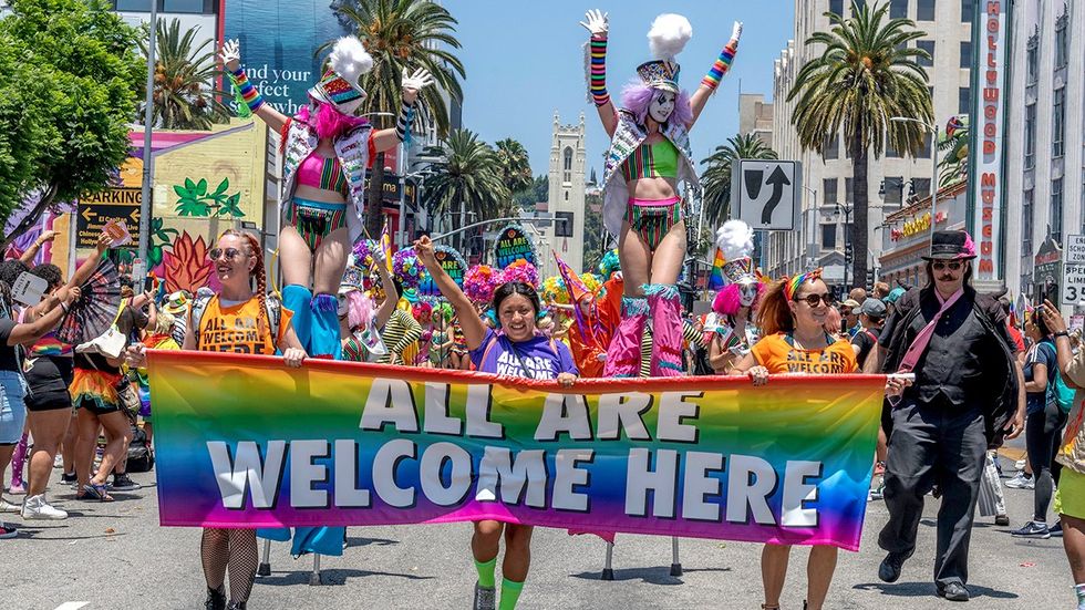 2022 Participants march LA LGBTQ Pride Parade all are welcome here banner