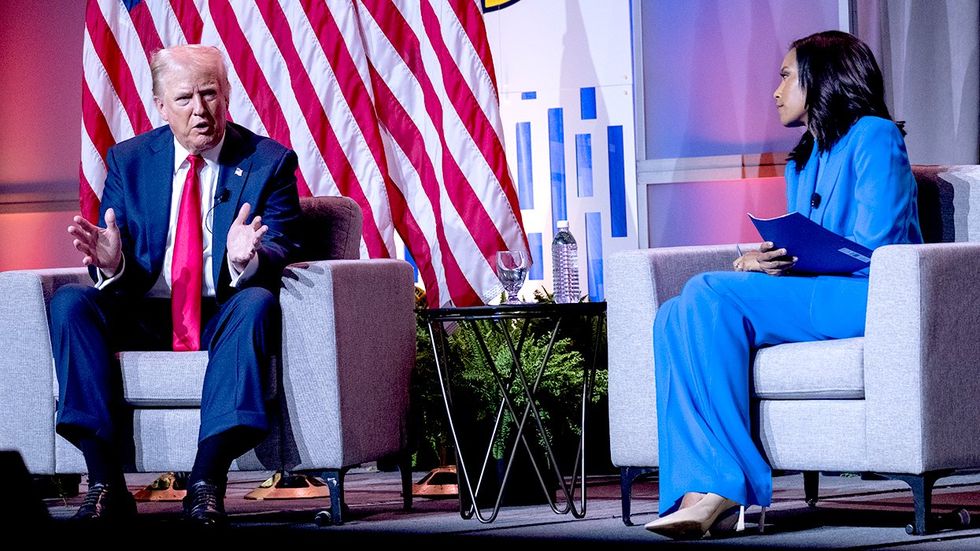 2024 Republican presidential nominee Donald Trump on stage with Rachel Scott senior congressional correspondent for ABC News conversation opening day National Association of Black Journalists NABJ Annual Convention Career Fair Chicago