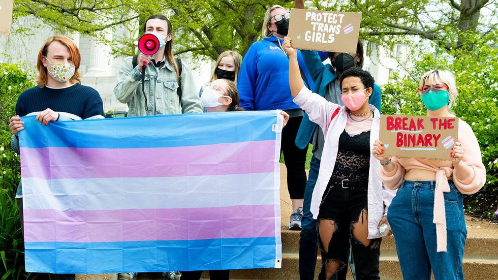 Activists gather at the Missouri State Capitol to demand equal rights for transgender humans and denounce anti trans legislation recently passed in the United States