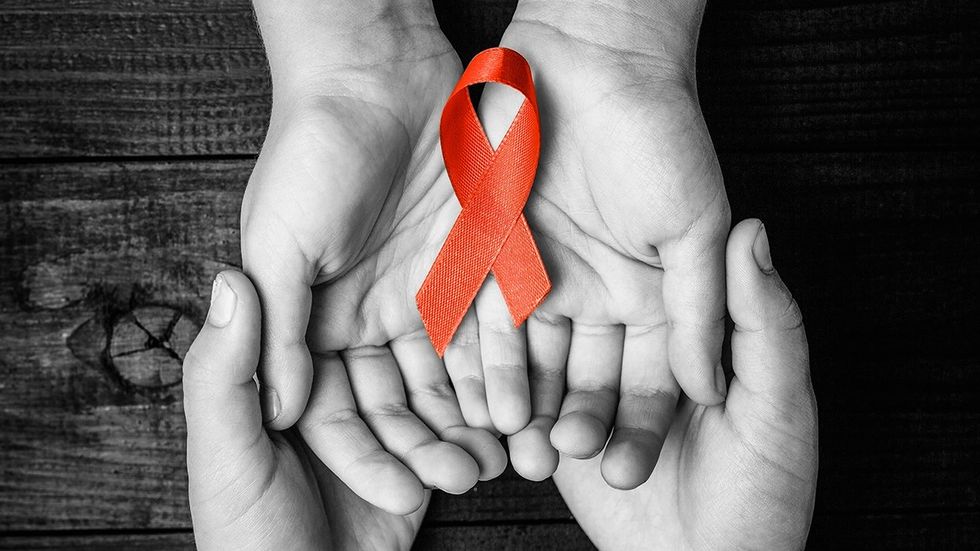 AIDS ribbon hands holding