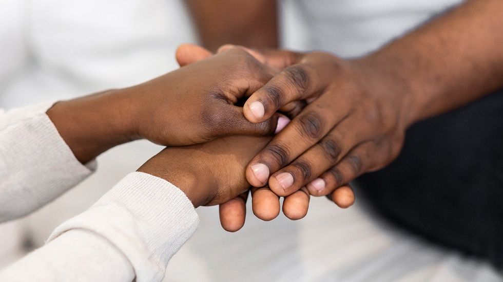 black men holding hands