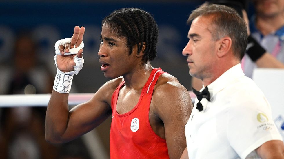 Cindy Ngamba of the Refugee Olympic Team celebrating after winning match