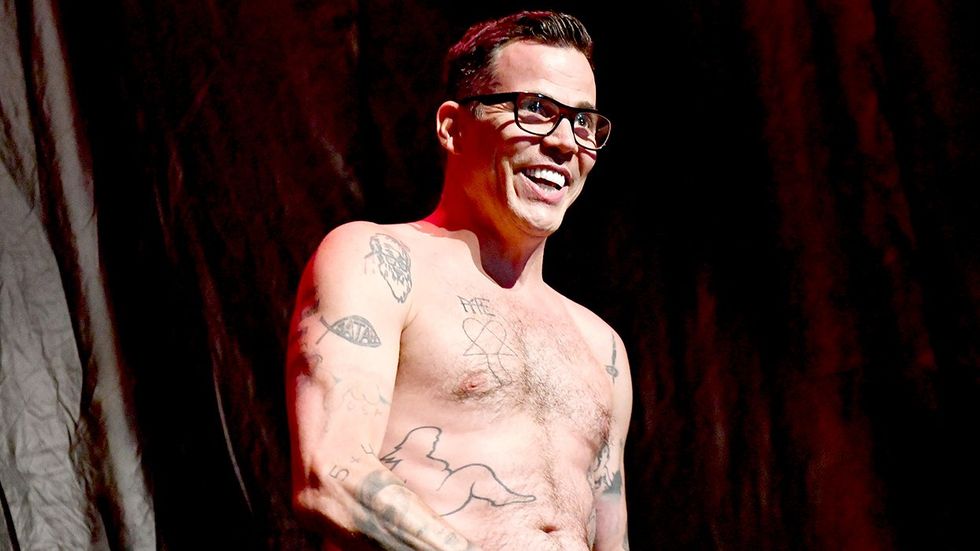 Comedian SteveO of the TV show Jackass appears shirtless onstage during the Above Ground concert benefiting MusiCares Los Angeles California