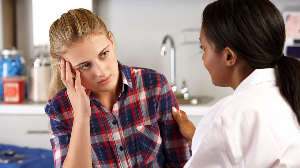 concerned transgender teen during doctor visit