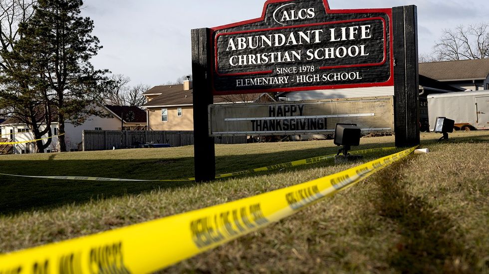 Crime scene tape stretched around Abundant Life Christian School as police continue to investigate school shooting December 2024 Madison Wisconsin