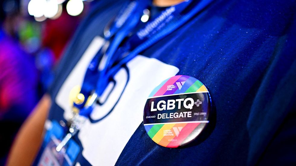 delegate wears a LGBTQ plus pin on the third day of the 2024 Democratic National Convention