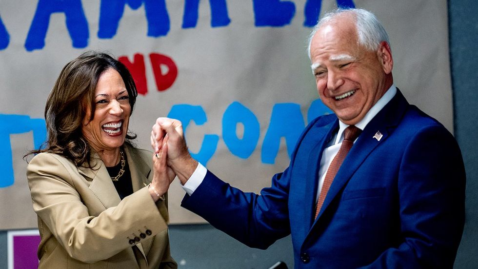 Democratic presidential candidate US Vice President Kamala Harris VP pick Minnesota Governor Tim Walz during campaign office visit Glendale Arizona