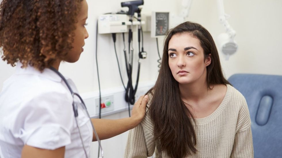 Doctor comforting a woman