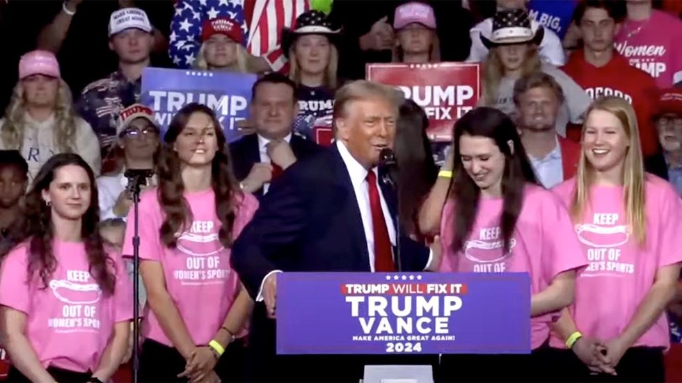 Donald Trump rally in salem virginia welcomes Roanoke College 2023 womens swim team who objected to transgender teammate wearing transphobic shirts