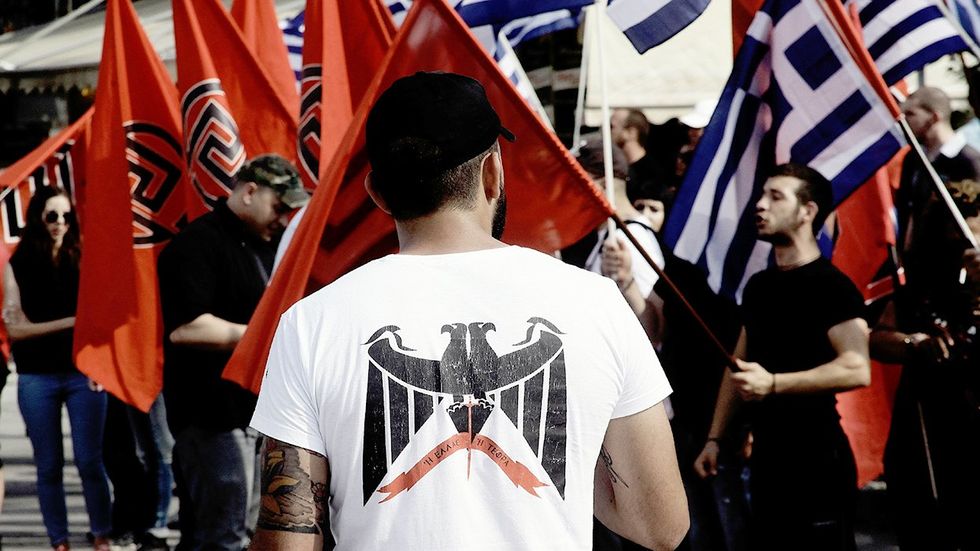 Farright Golden Dawn party supporters attend the main preelection rally outside the partys headquarters in Thessaloniki Greece