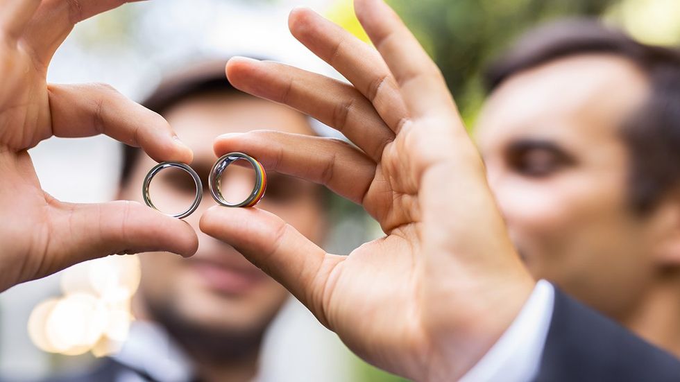 gay grooms two rainbow wedding bands