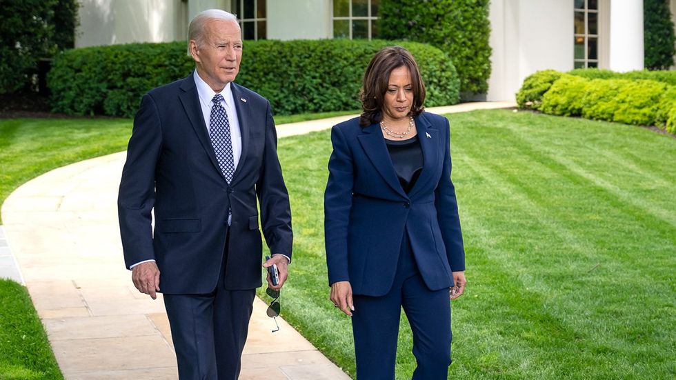 Joe Biden Kamala Harris walking together white house property