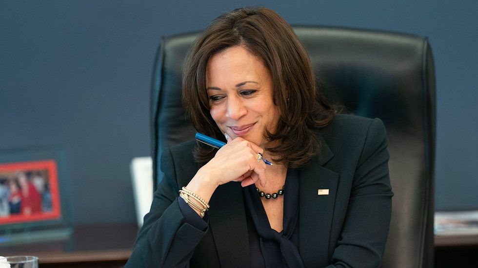 Kamala Harris happy working desk office