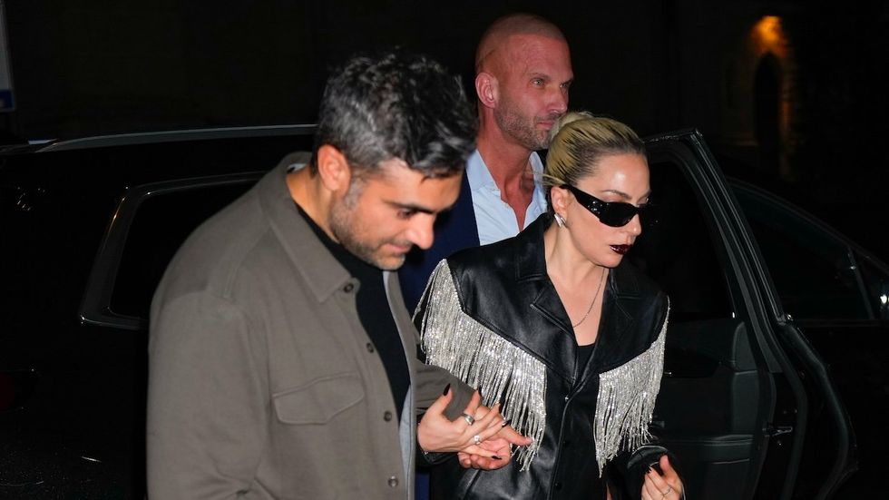 Lady Gaga holding hands with her partner Michael Polansky