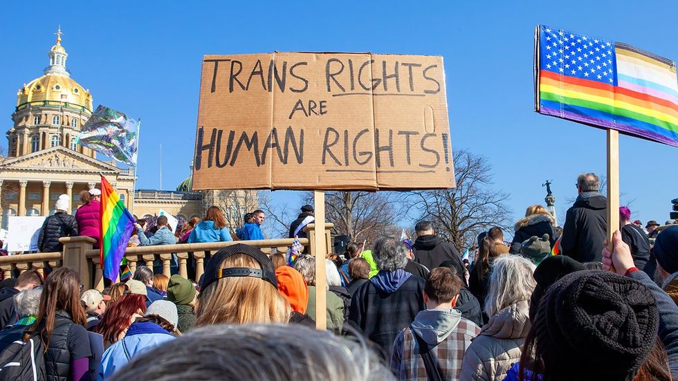 LGBTQIA rally Iowa State Capitol building rainbow american flag