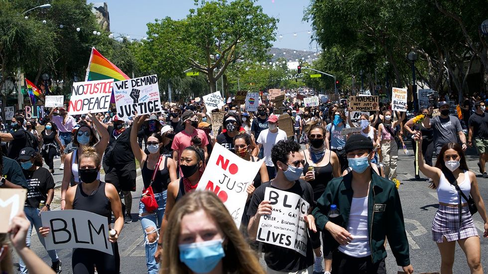 Los Angeles LGBTQ march against hate crimes BLM black lives matter