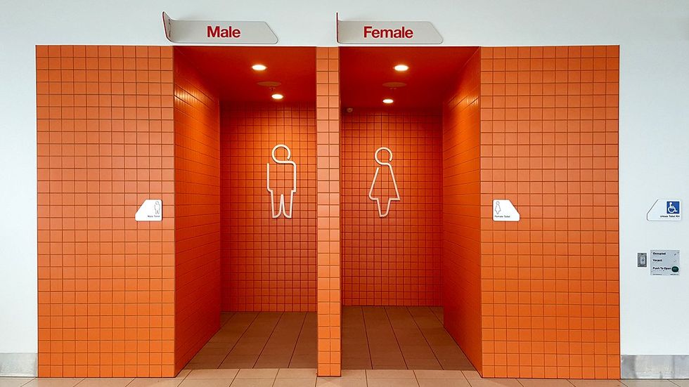 male female gendered public bathroom entrance