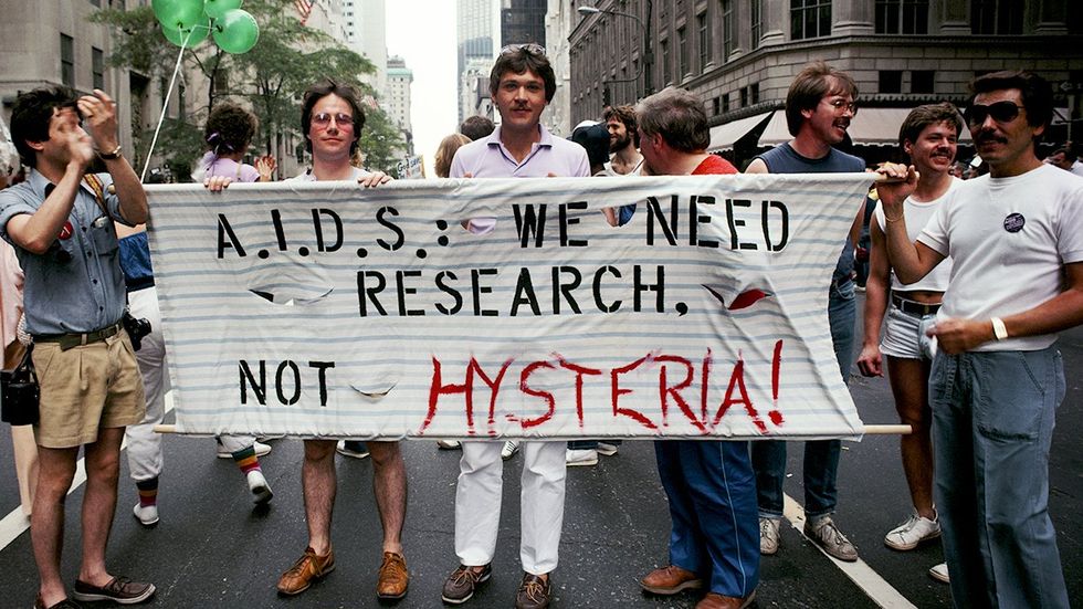 Marchers 1983 Gay Pride parade AIDS research banner Manhattan New York City