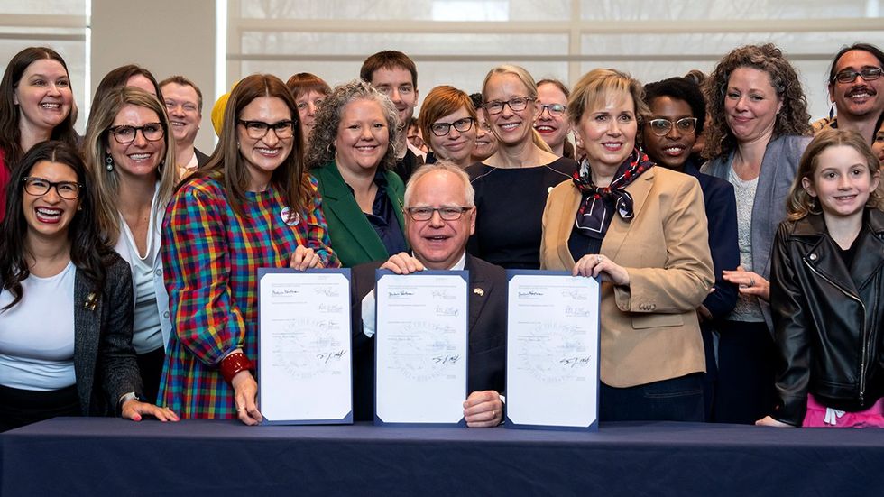 Minnesota Governor Tim Walz celebrates ban conversion therapy refuge state people traveling for abortion gender affirming care