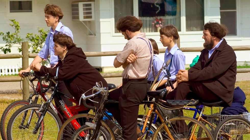 modern day Mennonite family multi-generational men boys on bicycles