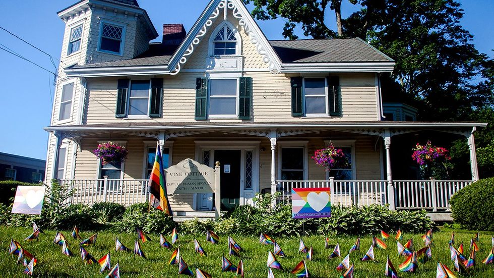 NEW CANAAN Connecticut vine cottage dept human services progress pride flags on front lawn celebrating LGBTQ rights