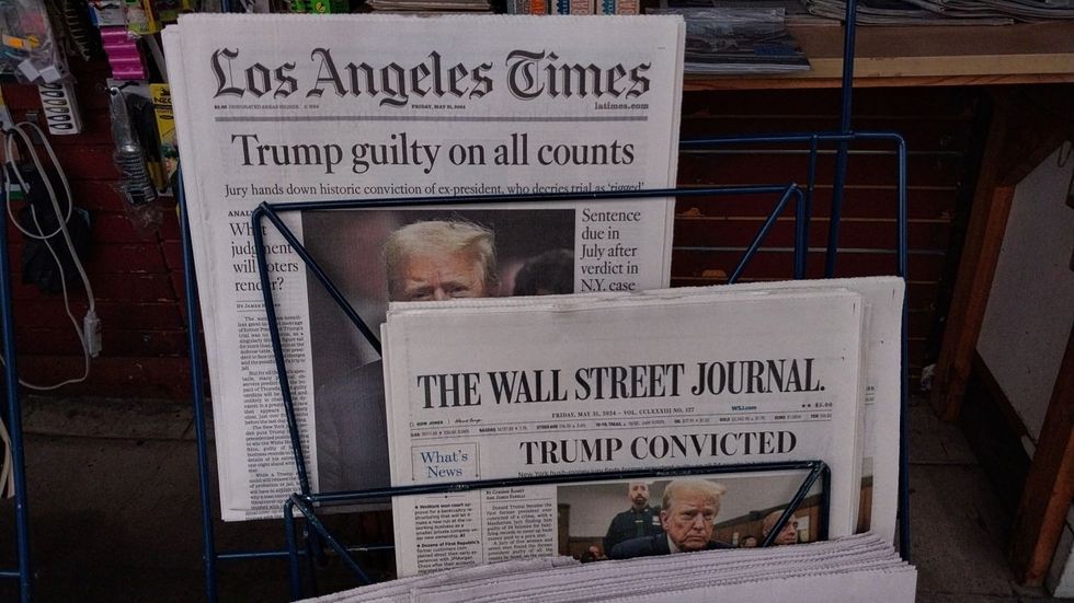 News papers detailing Donald Trump's conviction on the front page