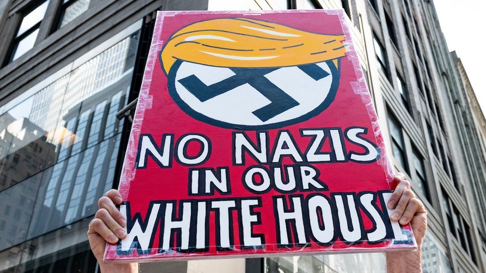 "No Nazis in our White House" sign at a protest rally against Donald Trump outside the Lotte New York Palace Hotel in New York City. Protesters took to the street to New York City in an anti Donald Trump rally against his foreign policy.