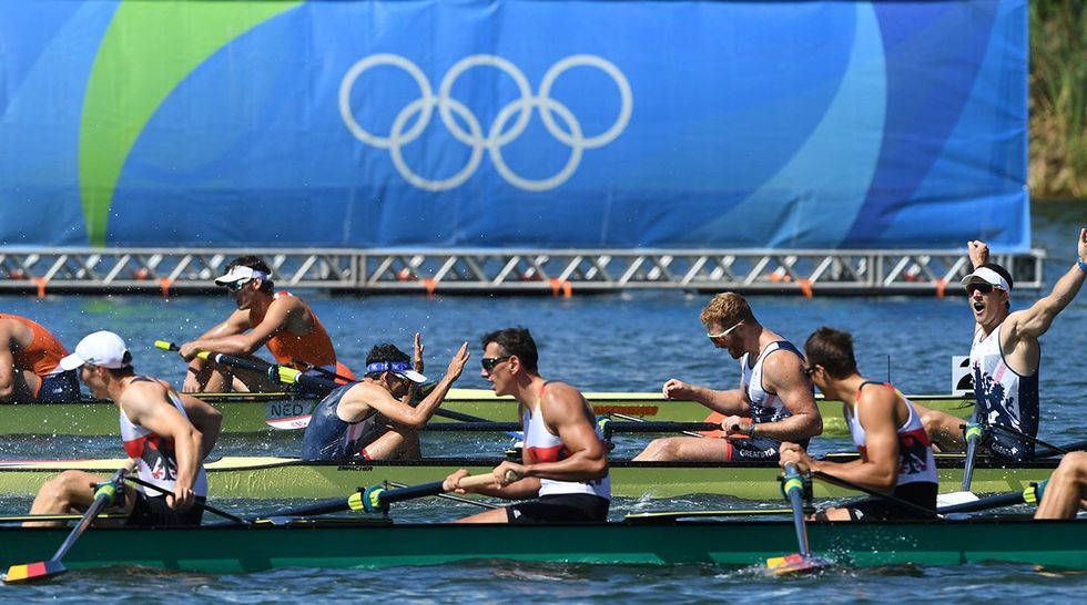 The United States Olympic rowing team celebrates after winning the gold medal in the men's rowing final at Rio 2016.