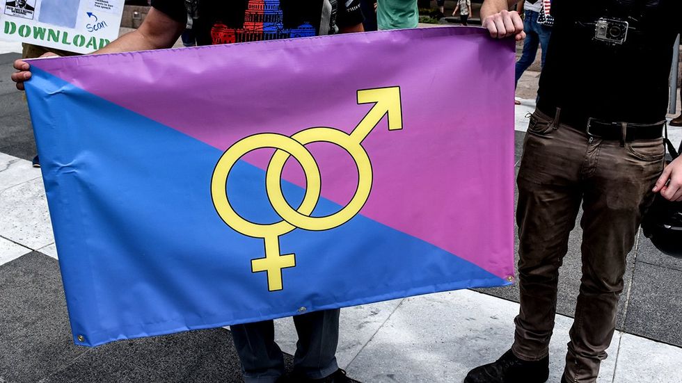 organizers of Straight Pride march hold flag at Demand Free Speech rally Freedom Plaza 2019 Washington DC