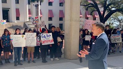 https://www.advocate.com/media-library/out-rep-carlos-smith-speaks-to-children-during-a-walkout.jpg?id=32654391&width=400&height=225