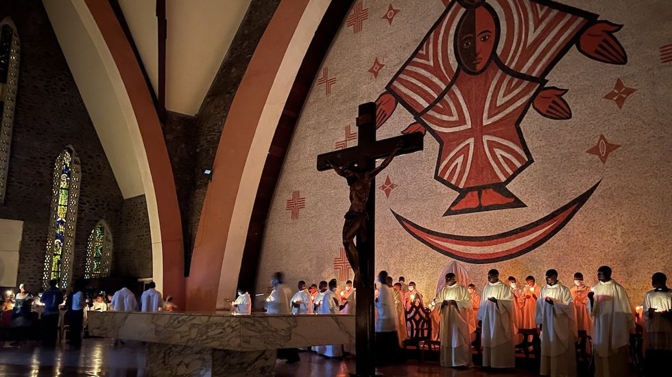 People gather inside at Notre Dame Des Victoires Cathedral in Yaounde, Cameroon