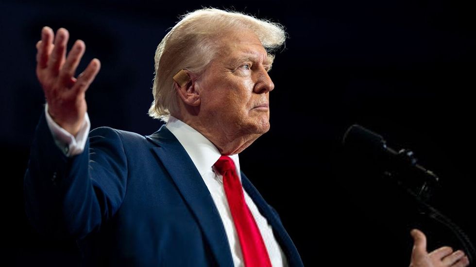 Republican Presidential former President Donald Trump exits after speaking at his rally at the Bojangles Coliseum CHARLOTTE NORTH CAROLINA