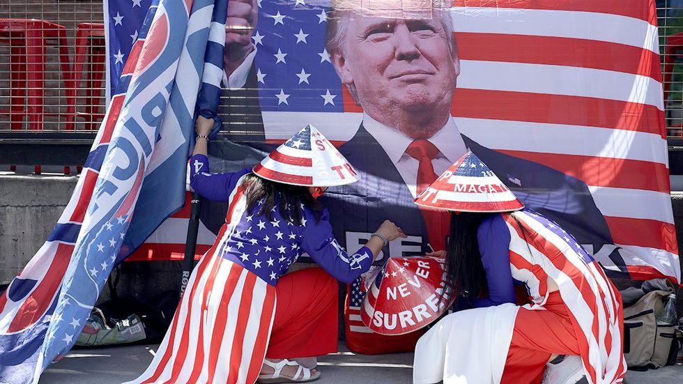 RNC day two insanity is this real life Supporters of presidential candidate Donald Trump rally outside of the Republican National Convention RNC 2024