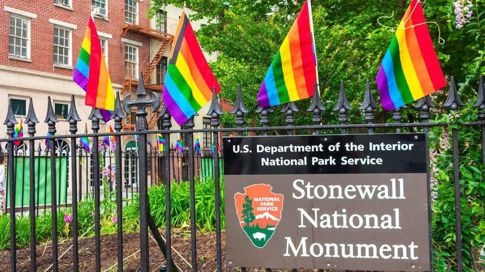 Stonewall National Monument sign and rainbow flags