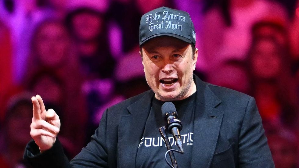 Tesla and SpaceX CEO Elon Musk wearing nazi font maga hat speaks at a rally for former US President and Republican presidential candidate Donald Trump at Madison Square Garden