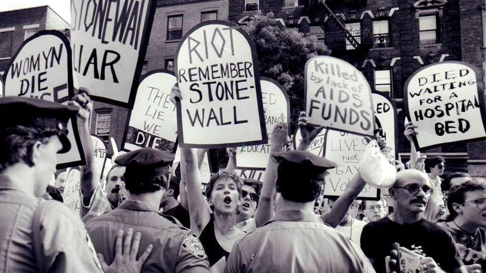 tombstone protest signs remember stonewall during 1989 dedication ceremony Stonewall Place Christopher Street Greenwich Village New York City