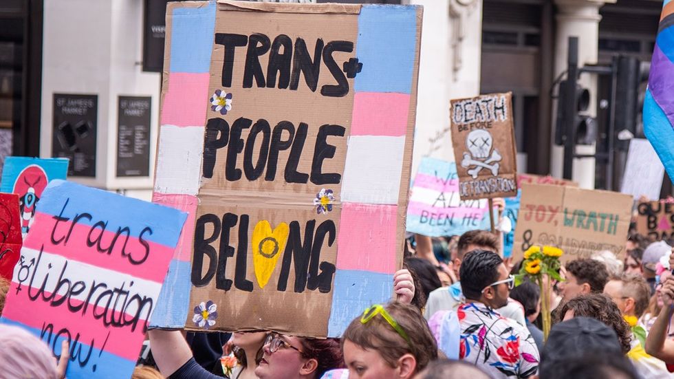 transgender health care protest signs