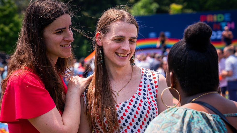 Transgender Journalist Erin Reed and her fiancee trans Montana State Rep Zooey Zephyr talk with Ruth Belay of Los Angeles during a Pride Celebration on the South Lawn at the White House in Washington DC