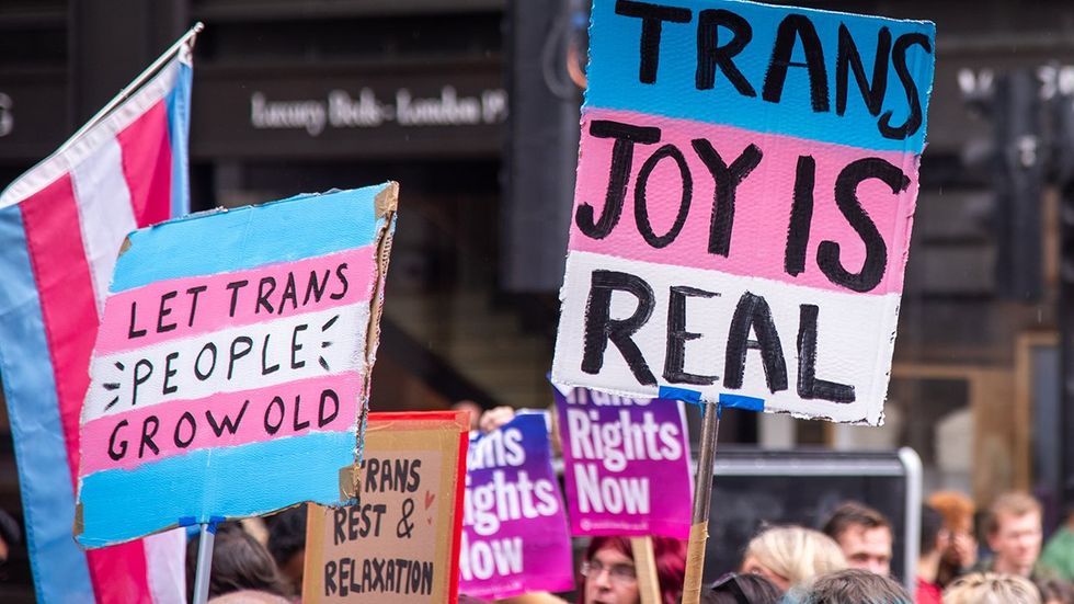 transgender pride march signs let trans people grow old trans joy is real