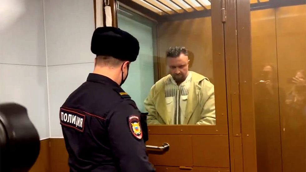 tweet Andrei Kotov is handcuffed and led out of the courtroom as filmed by several journalists as well as prosecutor Shcherbakova on her phone Video by Mediazona