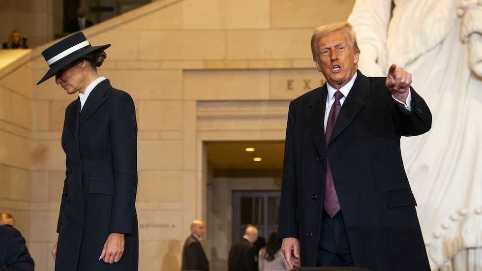  U.S. President Donald Trump and first lady Melania Trump after addressing guests and supporters in an overflow room in Emancipation Hall following his inauguration at the U.S Capitol on January 20, 2025 in Washington, DC.