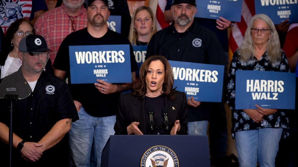 US Democratic presidential nominee Vice President Kamala Harris speaks to supporters during a campaign stop at a UAW hall during on October 18 2024 in Lansing Michigan