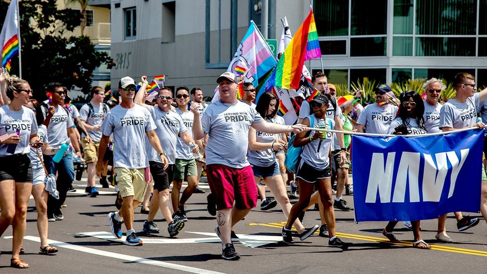 US Military contingent san diego LGBTQ pride parade rainbow transgender flags tshirts serving with pride