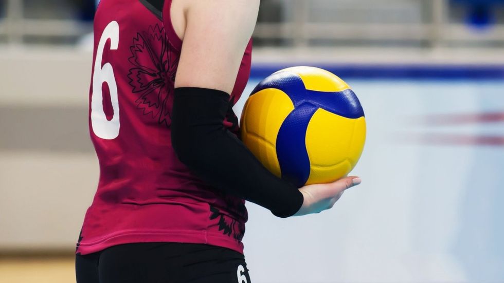 Volleyball player with volleyball in hand