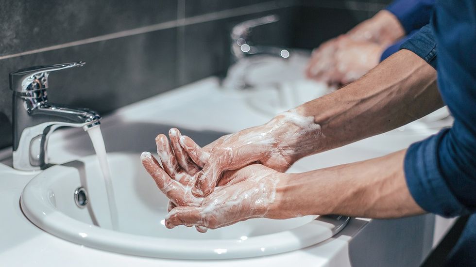 washing hands public bathroom