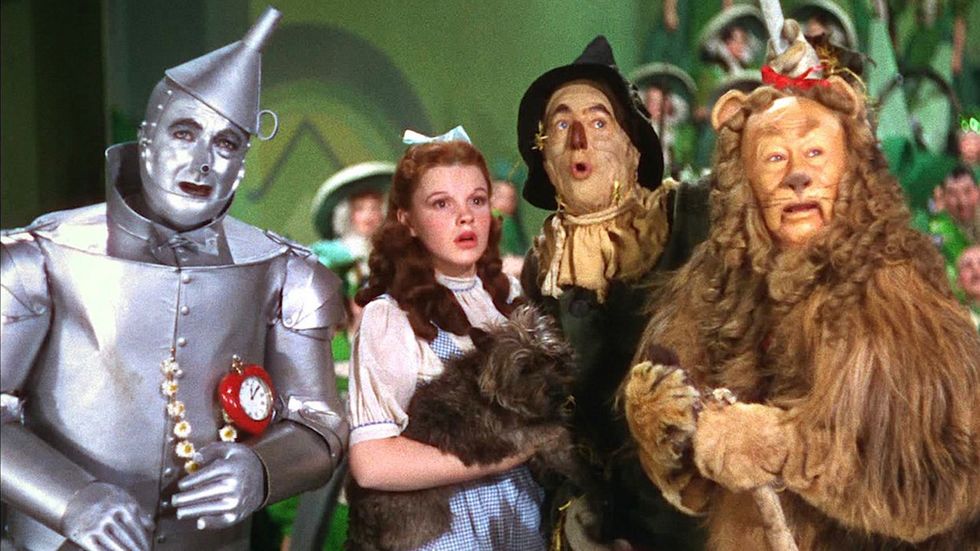 Wizard of Oz movie still tinman dorothy scarecrow lion surprised