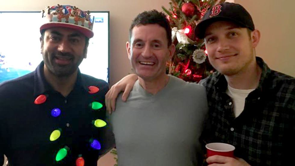 writer John Casey pictured center with actor Kal Penn and his boyfriend Josh celebrating festive holiday gathering