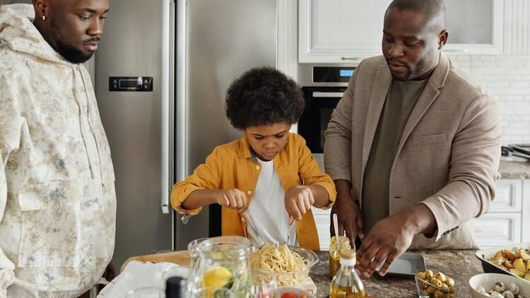 Fathers and son making dinner