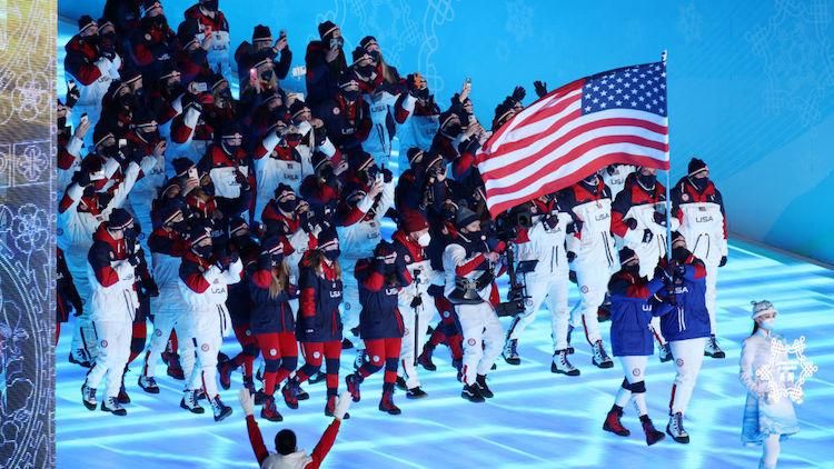 Britanny Bowe and fellow flag bearer entering the arena 